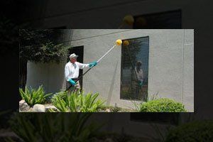 Exterminator — Man Wiping Pesticide in Fresno, CA