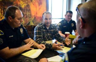 Michael Shepherd meets with members of the Anaheim Police Department to discuss how to improve relationships between agencies and people without housing