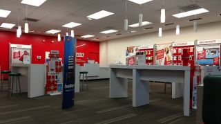 Palmdale, California Verizon Store interior with display tables of various smartphone brands. 