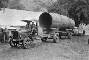 (ca. 1916)* - View of an early model truck hauling a section of penstock for Power Plant No. 1.
