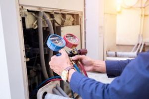 Technician Checking Air Conditioner — Rancho Cucamonga, CA — Soco Air Conditioning Company