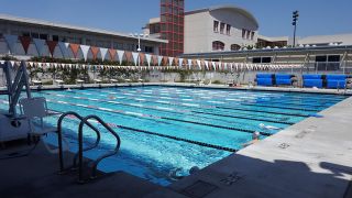 The outdoor pool is 366,00 gallons. It sits between 78-82 degrees year round. There are 10 lanes ranging from 4'6