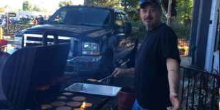 Our best friend Rudy serving up burgers and hot dogs for the car show.