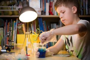 Young Boy Doing An Experiment — Fontana, CA — Montessori Child Development Center