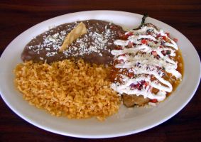 Chile Rellenos Platter Panela cheese-stuffed peppers in crispy egg coating topped with pico de gallo*, sour cream and cotija cheese