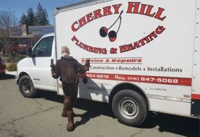 Man Standing Beside The Car — Santa Rosa, CA — Cherryhill Plumbing & Heating