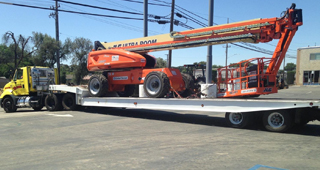 Heavy Equipment Transport including 20 foot containers, storage sheds and more