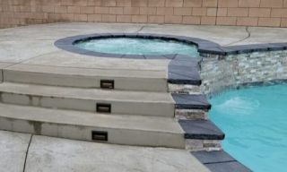 custom spa by the pool