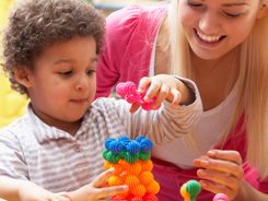 Woman Playing with a Child